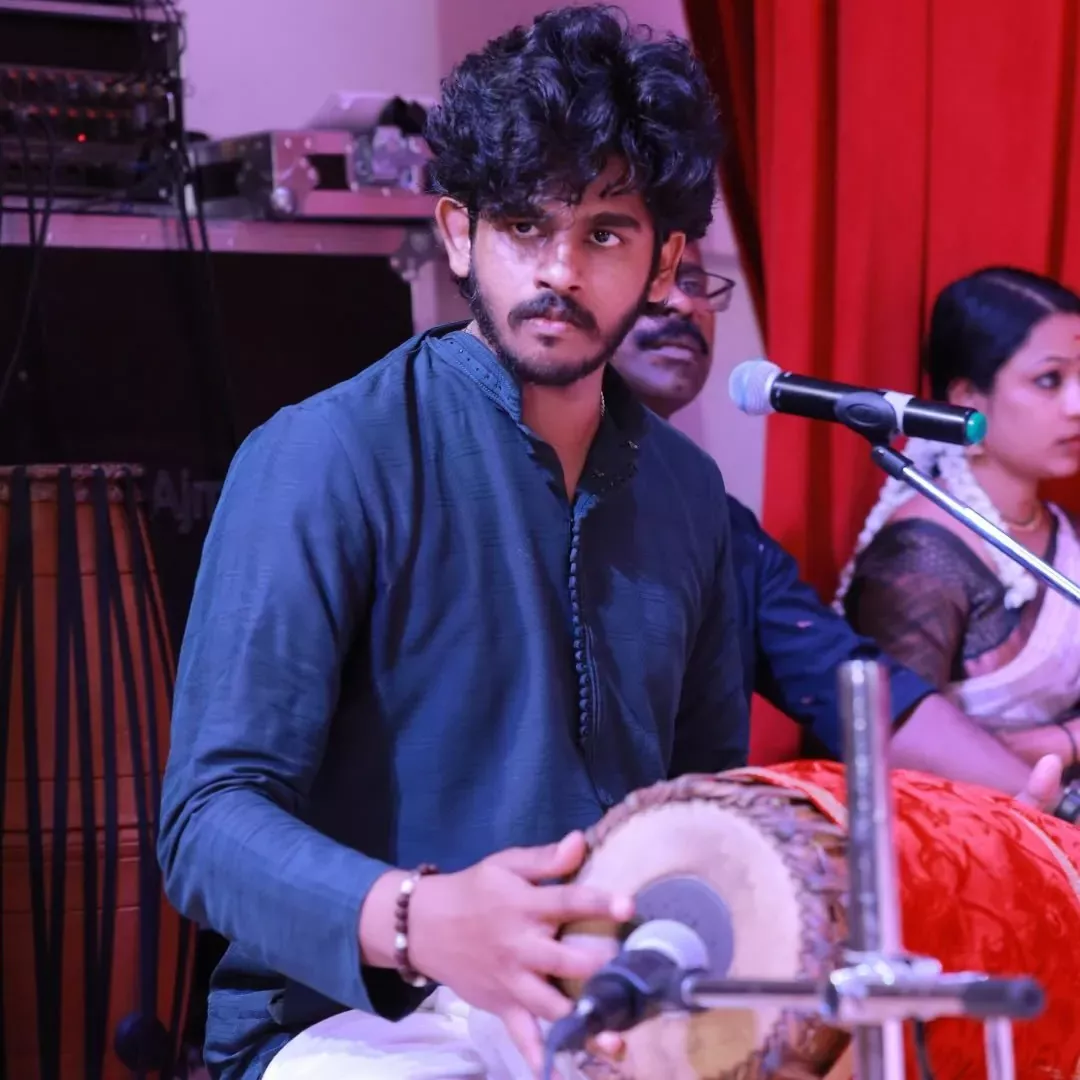 Nakul Kallat playing mridangam - Indian Percussion Live Performer and Recording Artist at Kairali Arts Centre Sharjah